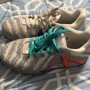 Nike Athletic Shoes with Gray and Teal Accents